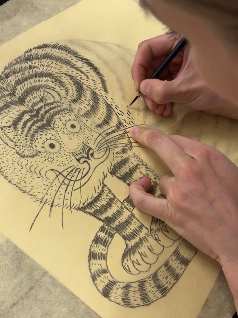 Close-up of a tiger Minhwa painting in progress